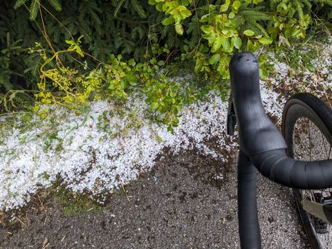 Roadside covered with hailstones.