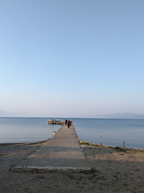Fishing men on a concrete pier at lake Ohrid.