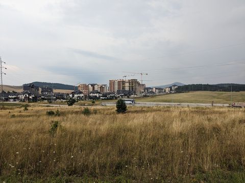 The skyline of Zlatibor. Highrise hotels, some still under construction, in the middle of a serene landscape.