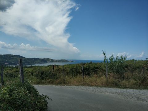 Photo of some road and the sea